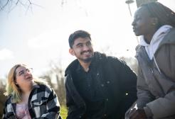 Sujan chatting with friends in Peel Park
