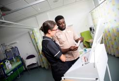Nursing associate handling medications, supervised by a tutor