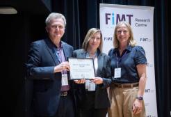 Research Fellow Dr Philip Martin and Professor Lisa Scullion are presented with the Impact and Innovation Award at the FiMT Research Centre conference
