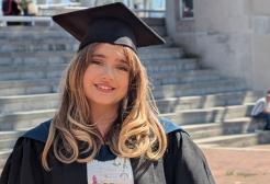 Phoebe Hall in her graduation cap and gown