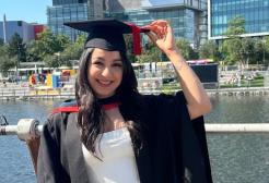 Asma in her Graduation cap and robes at MediaCity