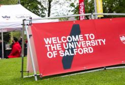 Welcome to the University of Salford signage on campus