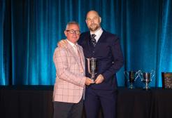 Professor Paul Comfort (right) receiving the 2025 William J. Kraemer Outstanding Sport Scientist Award from NSCA President Professor Ian Jeffreys