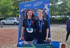 Lucy with a medal and a fellow contestant