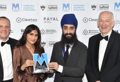 Salford professors and a student present an award at the Asian Media Awards