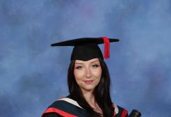 Rachel wearing her graduation cap and gown