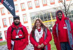 Three Student Ambassadors in front of University of Salford building