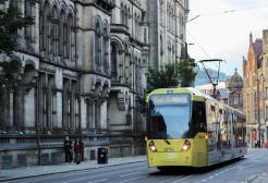 Tram travelling through Manchester city centre
