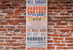 Colourful Victorian-era poster advertising a brass band contest at the Rifle Barracks on Elm Tree Avenue, Hull, on Monday 20 July 1868, featuring prize amounts, a list of participating brass bands, and details of concerts and performances.