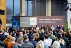 A panel discussion in front of an audience