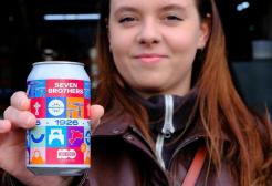 Anhelina holds a can of the new Seven Bro7hers ale