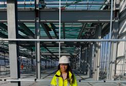 Hannah Daly in hardhat and hi-vis - BSc (Hons) Quantity Surveying 
