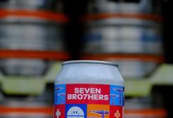 A hand holding the ale can designed by graphic design student Anhelina