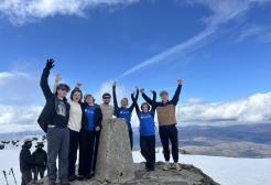 A group of hikers at the top of Ben Nevis