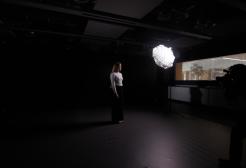 A photographer taking a photo of Sri Hollema in a studio