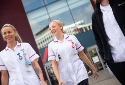 Student Nurses Walking Outside Mary Seacole Building