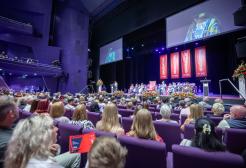 A wide shot of the graduation stage at the Lowry theatre
