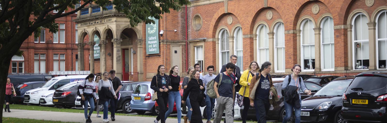 Students on a campus tour on the University of Salford Peel Park campus