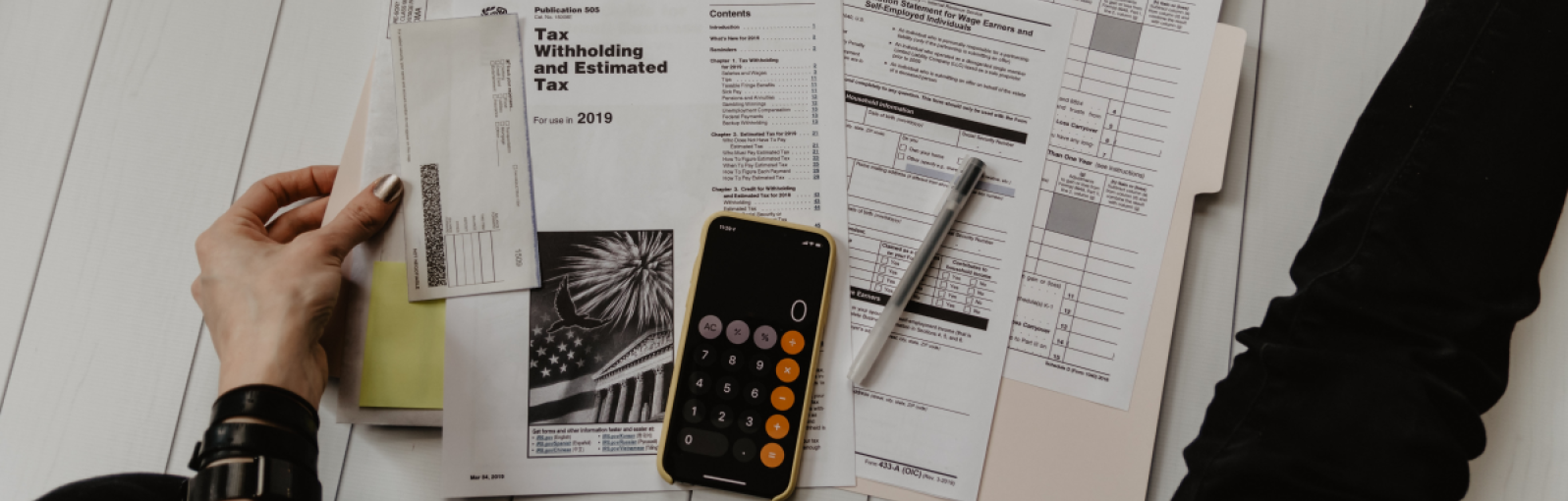 A person calculates their tax