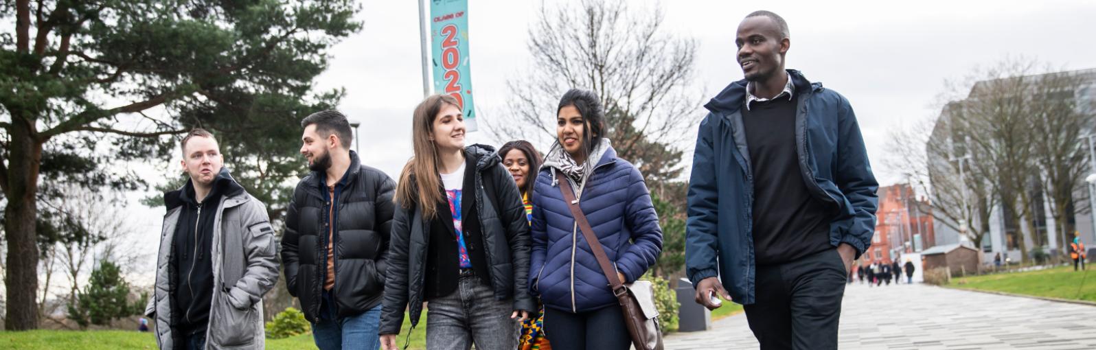 Salford International students walking together