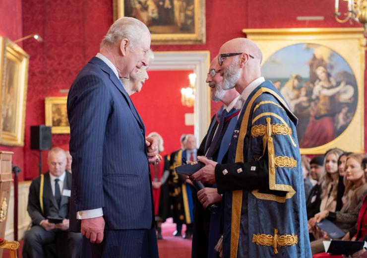 Professor Nic Beech and Professor Will Swan receive an award from The King and Queen