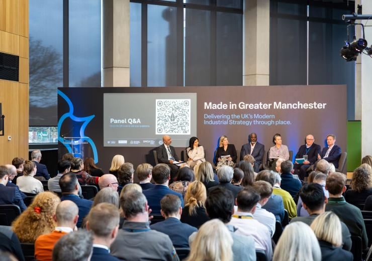 A panel discussion in front of an audience