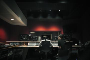 Two students in a recording studio