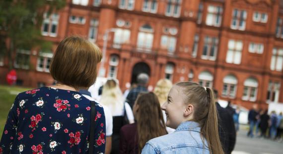 Student and parent take a tour of the Peel Park Campus, University of Salford
