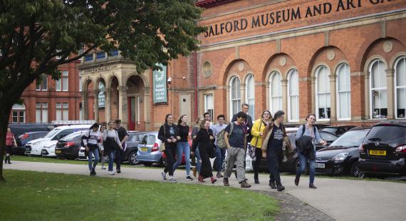 Students on a campus tour on the University of Salford Peel Park campus