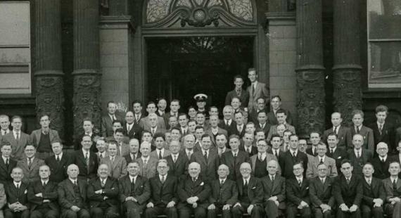 Archive image: A group of academics pose for a photo outside the Peel Building.
