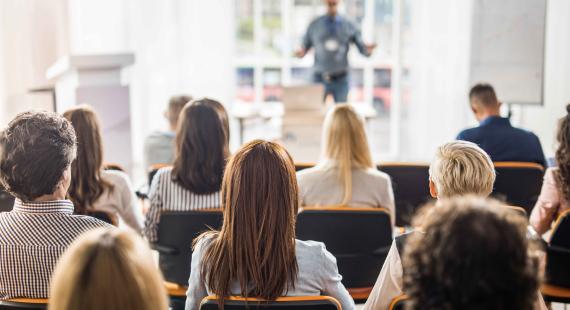 Back of the heads of students sat in lecture