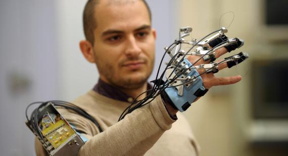 Man demonstrating a robotic arm