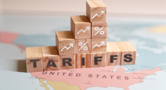 Building blocks with graph and tariff lettering on top of a map of the USA