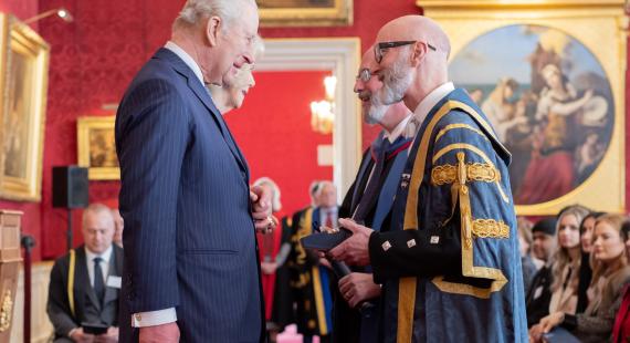 Professor Nic Beech and Professor Will Swan receive an award from The King and Queen