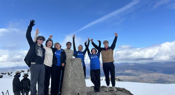 A group of hikers at the top of Ben Nevis