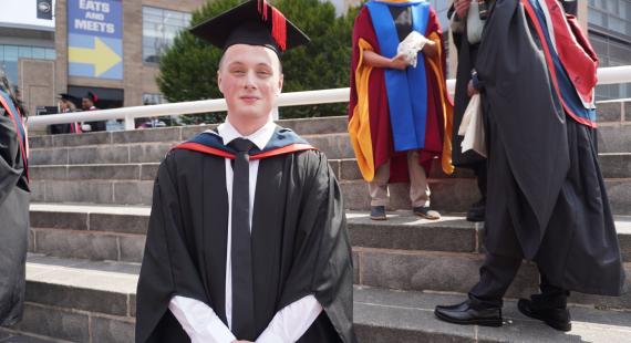 Liam pictured in his graduation cap and gown