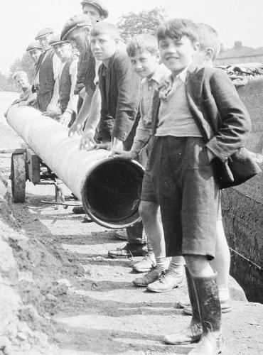 Boys help out with the maintenance of the canal