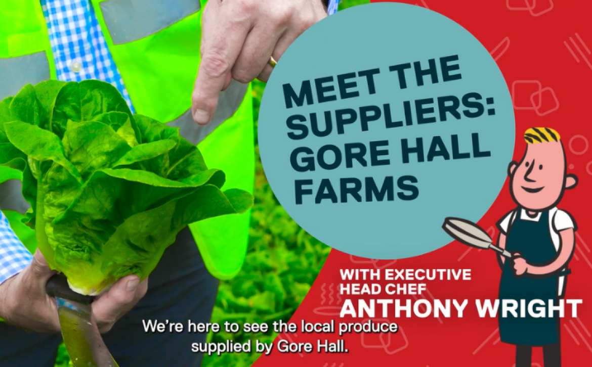 cartoon of our chef Anthony Wright gesturing to a real fresh picked lettuce from Gore Hall Farm