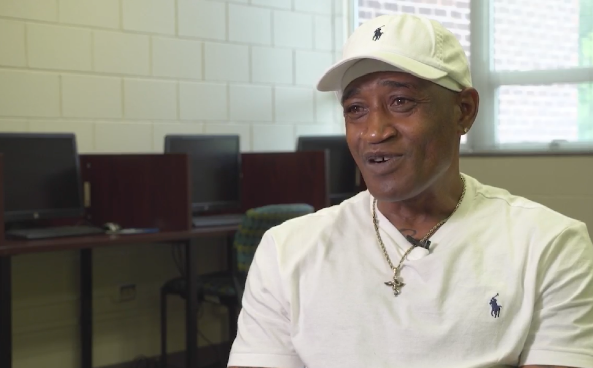 Reggie in a white baseball cap 