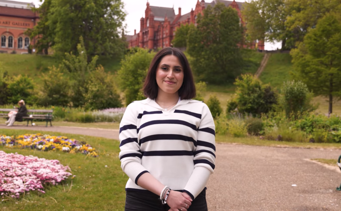 Huda stood in Peel Park, Salford 
